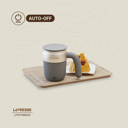 Gray mug with handle on a wooden tray with dessert, LèPresso branding visible