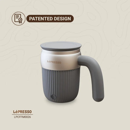Gray and silver mug with handle and lid, featuring LePresso branding on a beige background.