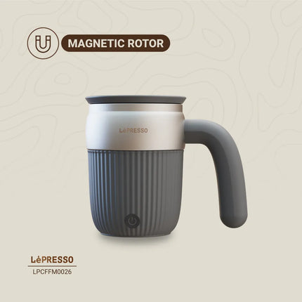 Gray mug with handle and ribbed design on a beige background, featuring 'Lepresso' branding.