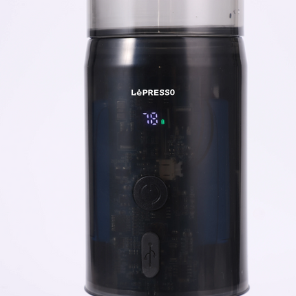 Black coffee grinder with digital display on a white background