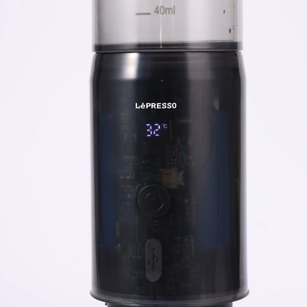Black Lépresso coffee machine with digital display on a white background