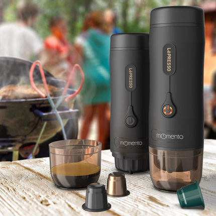 La Presso espresso machine and accessories on a wooden surface with a blurred outdoor background