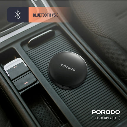 PORODO Bluetooth device in a car's air vent with 'Bluetooth V5.0' label.