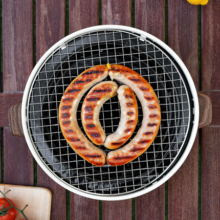With its compact and portable form, the Porodo Lifestyle Mini Portable Charcoal Grill captures the spirit of outdoor cooking. Its lightweight design m
