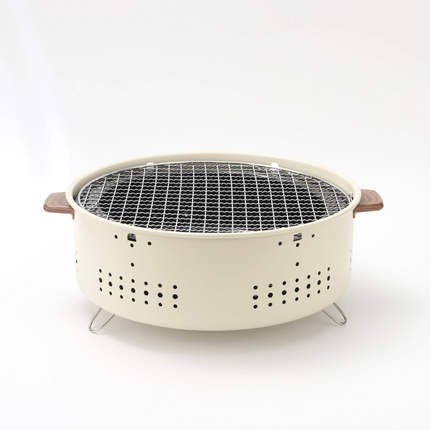 With its compact and portable form, the Porodo Lifestyle Mini Portable Charcoal Grill captures the spirit of outdoor cooking. Its lightweight design m