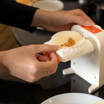 The Porodo LifeStyle Portable Dumpling Maker is an electronic and portable dumpling maker that makes it easy to create delicious dumplings at home. Wi
