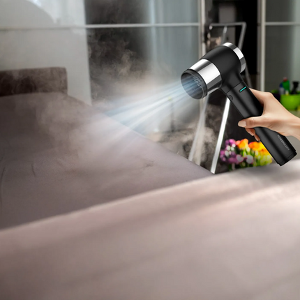 Person using a handheld steam cleaner on a bathroom mirror